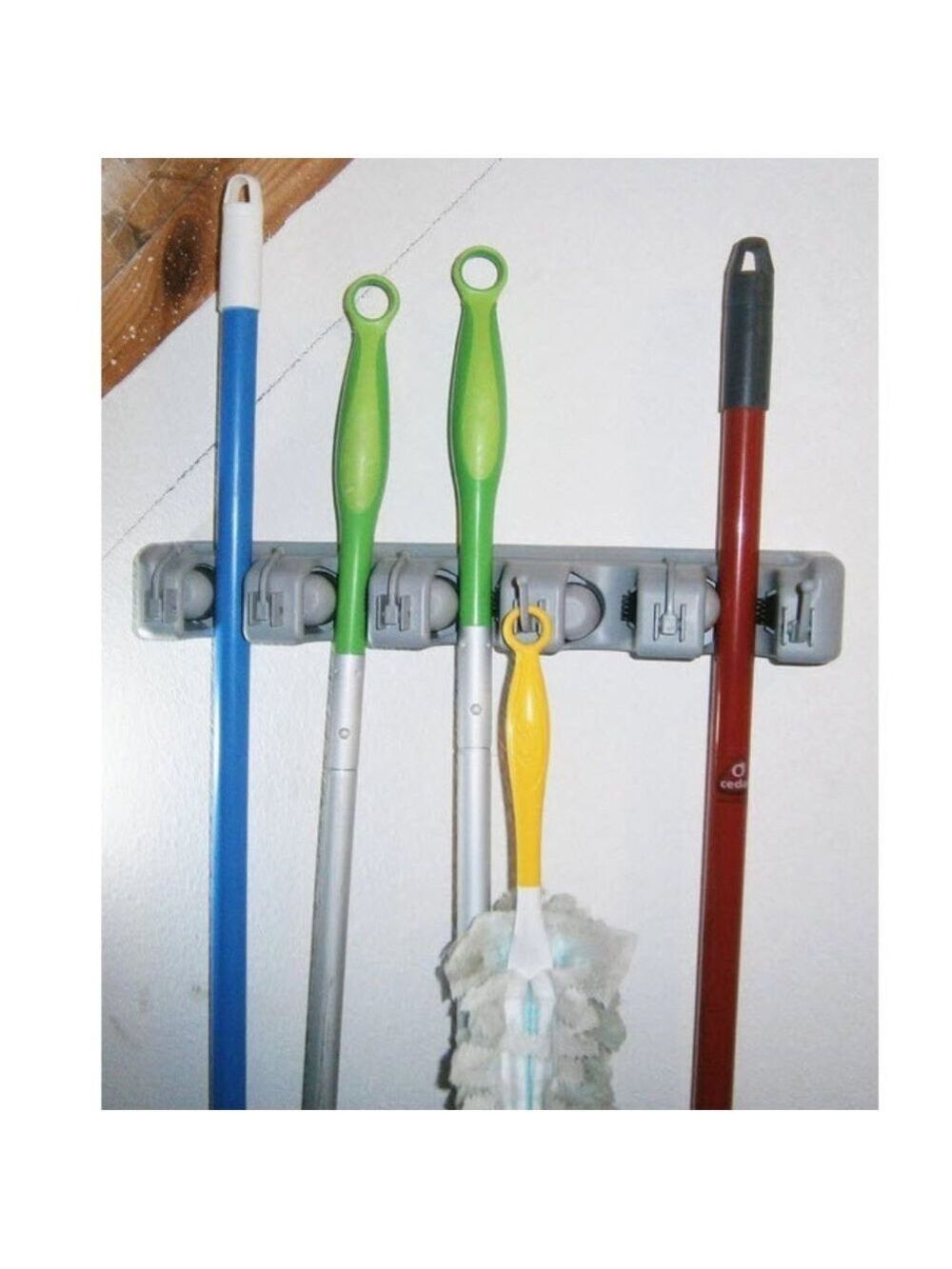 Wall mounted broom & tool holder